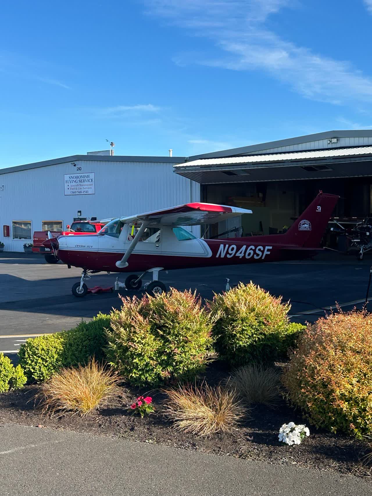 General-aviation aircraft beside a hangar
